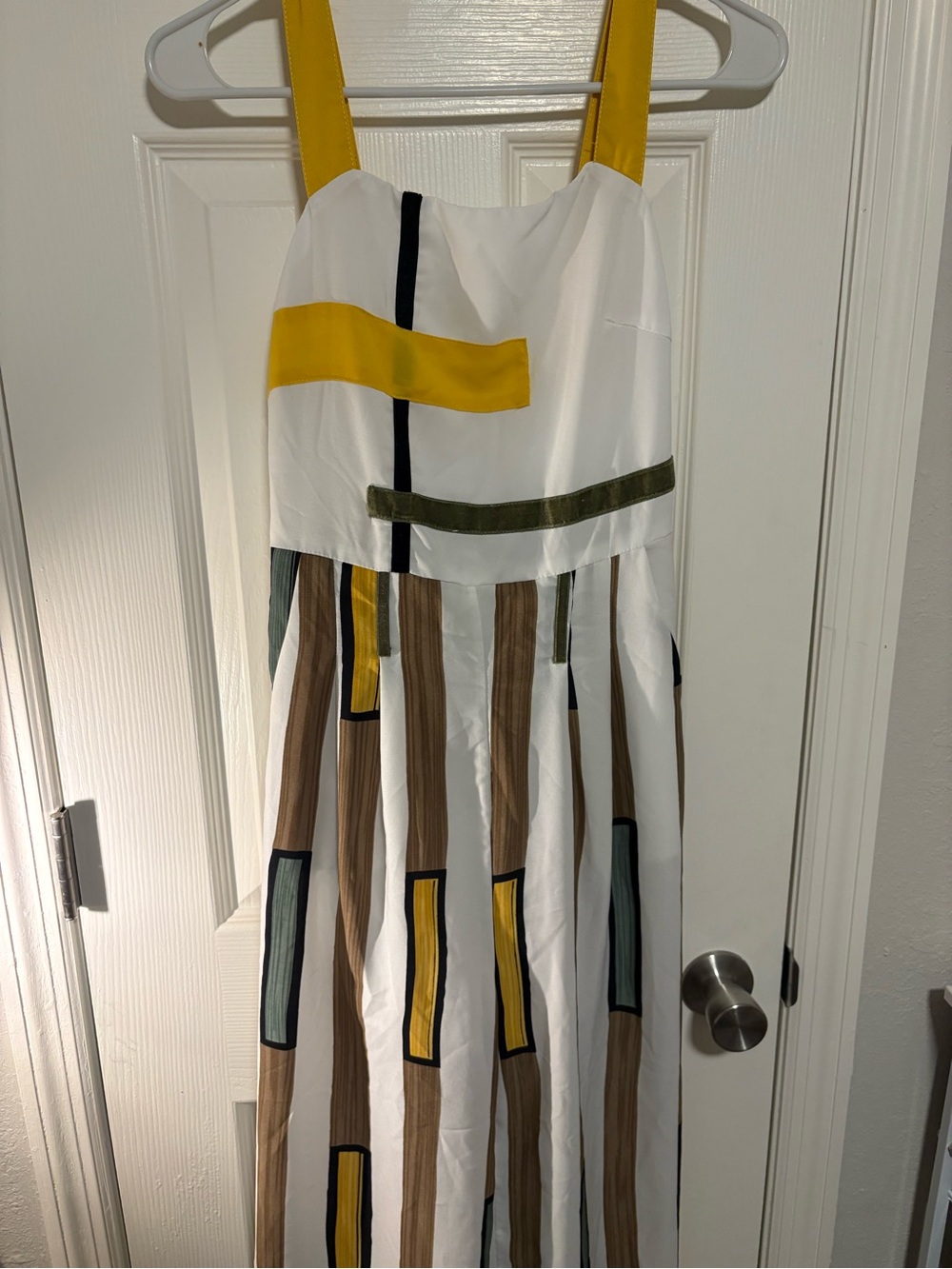White Sleeveless Jumpsuit with Yellow Straps and Geometric Print
